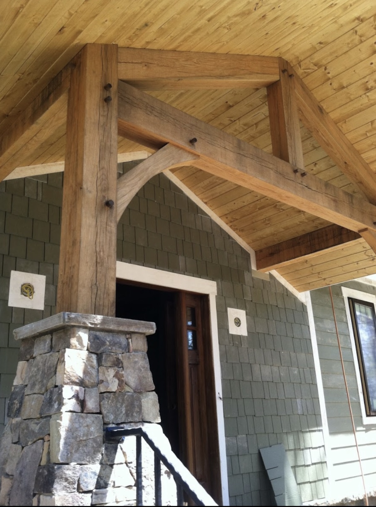 Timber frame entry portico with stacked stone column — Brevard NC
