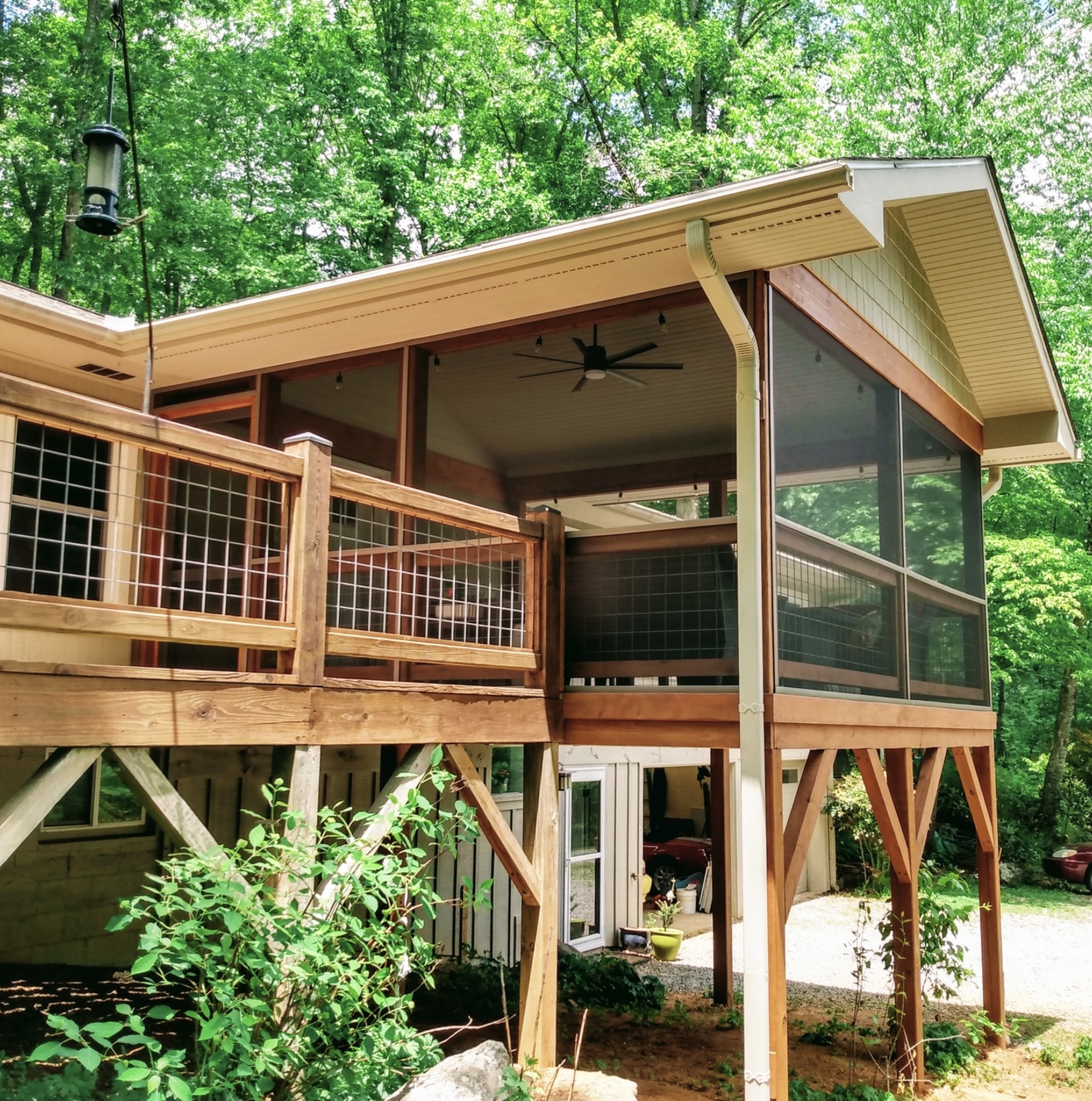 Elevated screened porch with cedar framing and hog-wire deck — Brevard NC