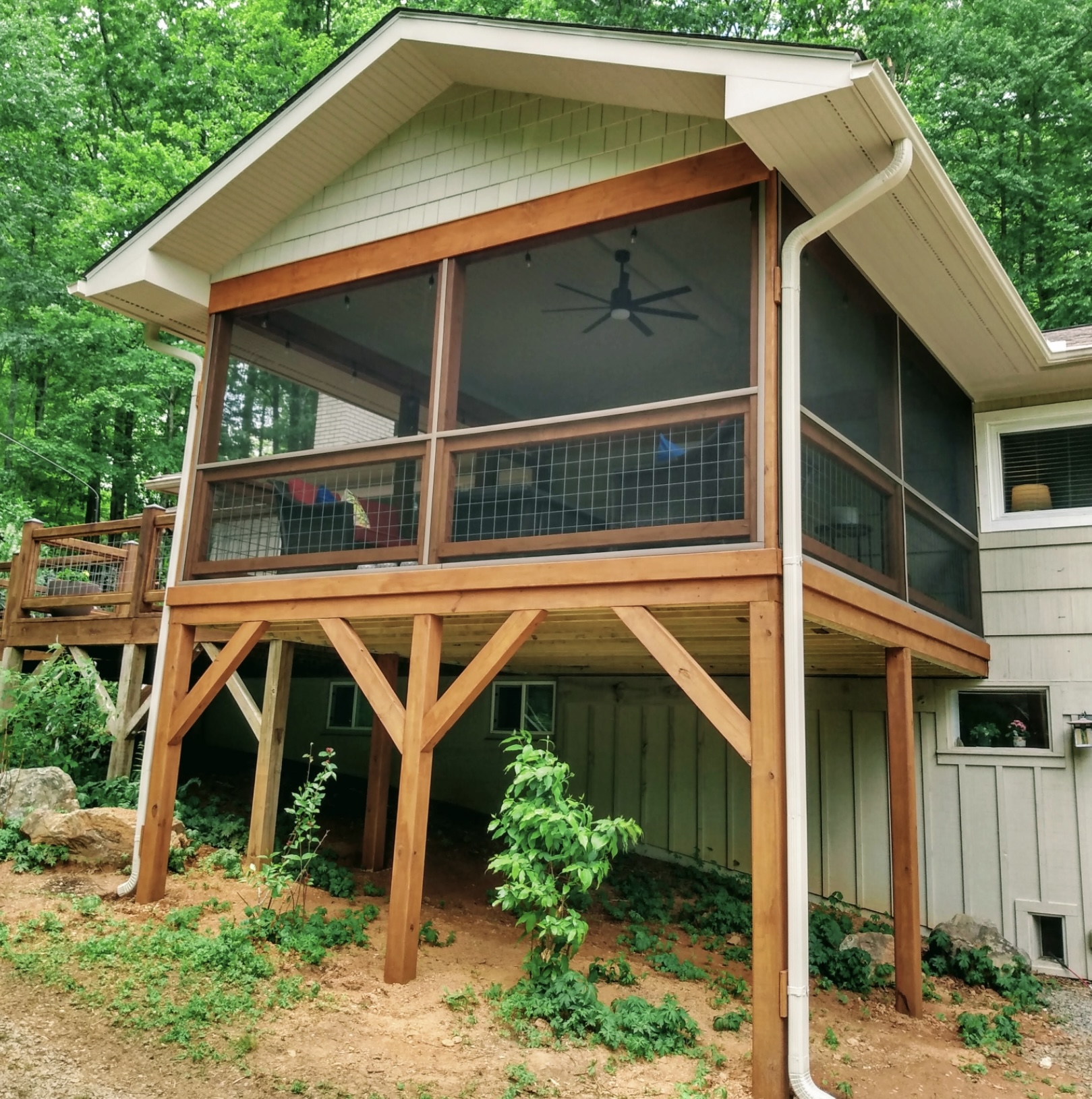 Timber-bent screened porch on hillside — Western NC
