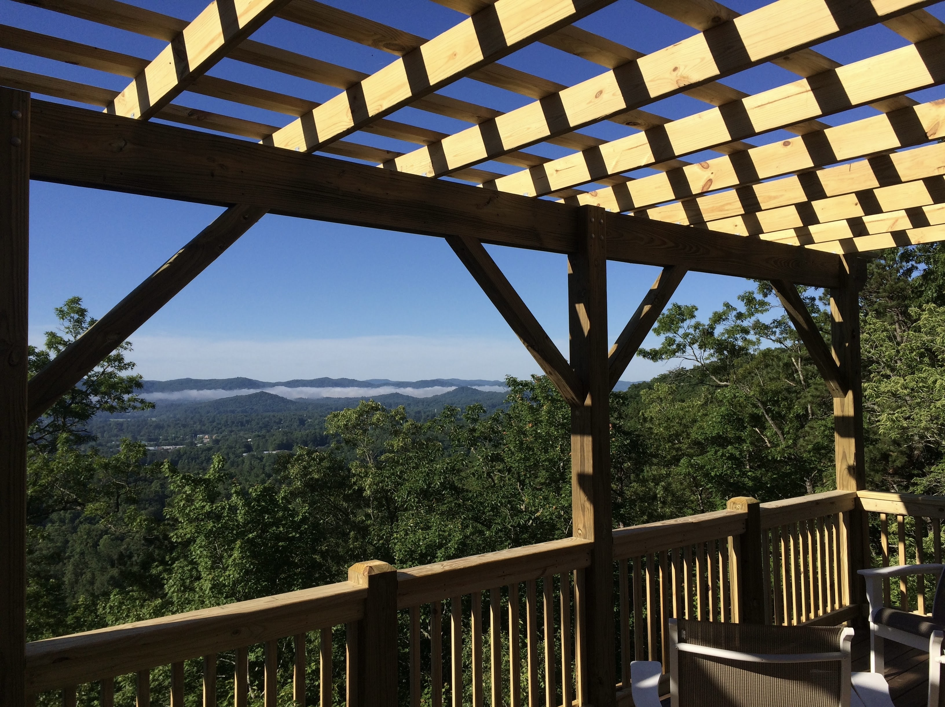 Timber pergola deck with Blue Ridge mountain fog — WNC