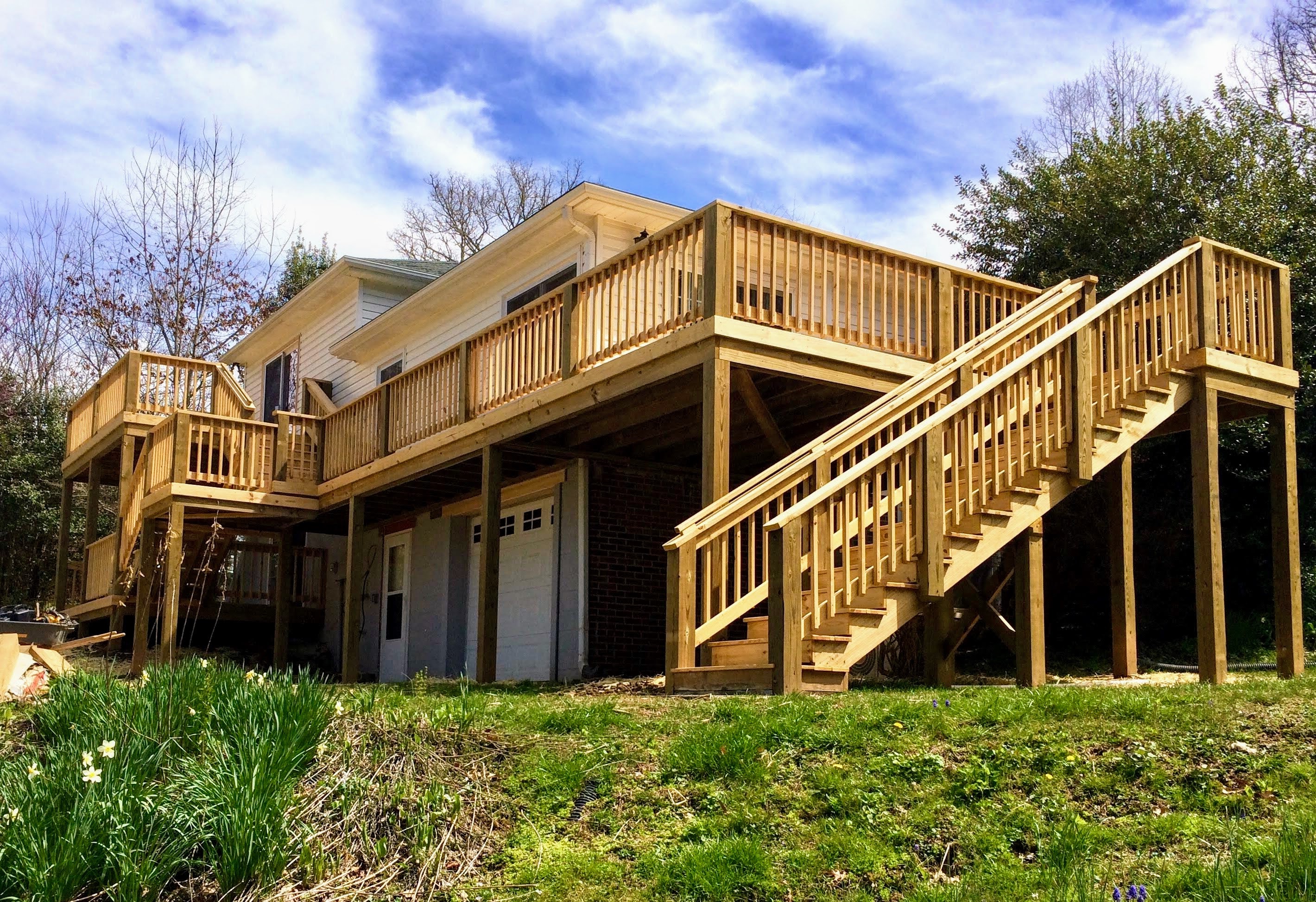 Elevated wrap-around deck with dual staircase — brick home WNC